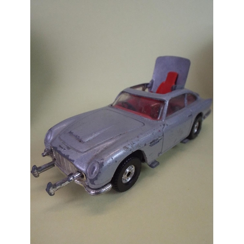 77 - Corgi, James Bond 007 Aston Martin DB5 in playworn condition.