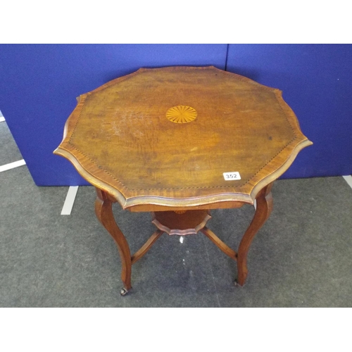 352 - Edwardian era inlaid occasional table on original castors. Shelf under.