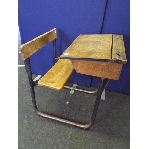 370 - 1940's era metal framed wooden school desk with bench seat attached.