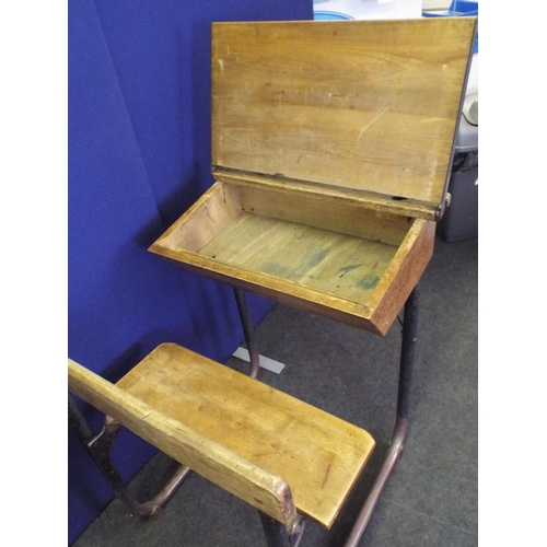 370 - 1940's era metal framed wooden school desk with bench seat attached.