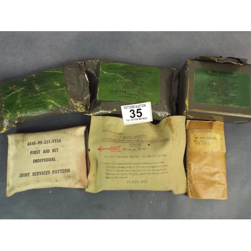 35 - Army first aid kits, field dressings, wire snare etc.