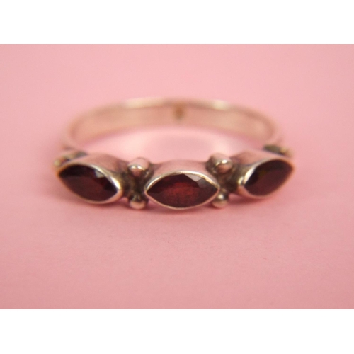 60 - Three stone set silver dress ring.