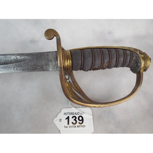 139 - WW1 Officers Dress sword. Engraved blade & leather scabbard. TP Edwards, Royal army Medical corps.