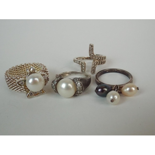 31 - Four 925 silver pearl set rings