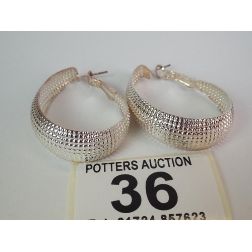 36 - Pair of large hoop earrings marked 925