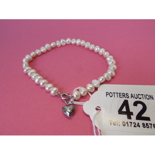 42 - Freshwater pearl bracelet with silver heart & fastner.