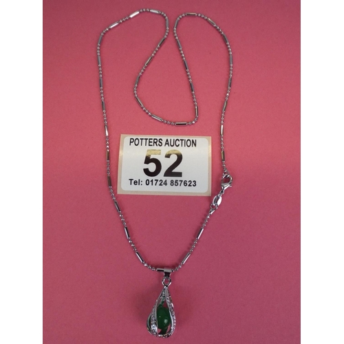 52 - 925 Silver caged jade ball pendant on 925 silver chain.