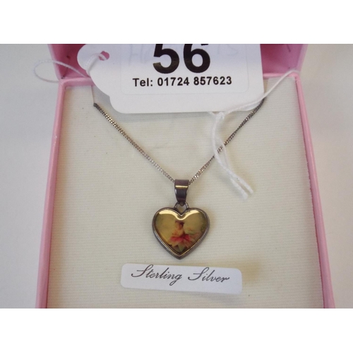 56 - Sterling silver heart shaped pendant & chain with presentation box.