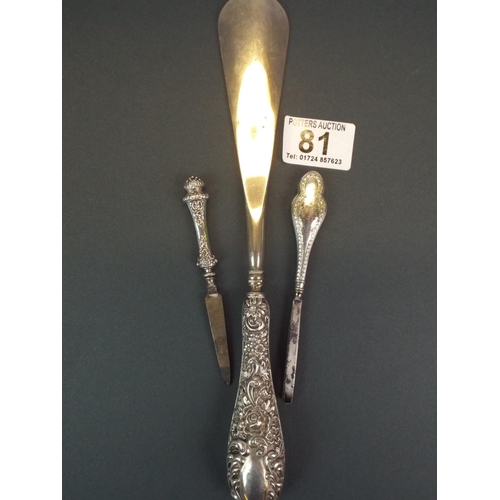 81 - Silver Handled shoe horn plus two Silver handled manicure items.