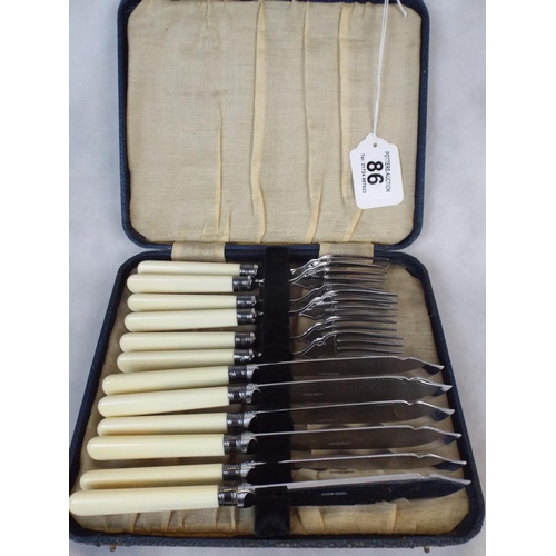 86 - Cased set of Fish Knives & Forks with silver collars.