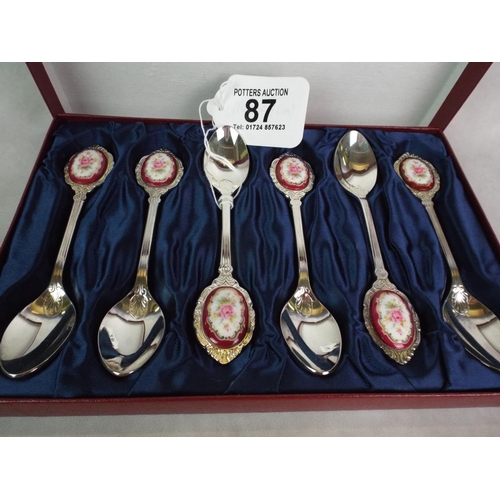 87 - Cased set of Six S/P Teaspoons with Limoge medallions to handles.