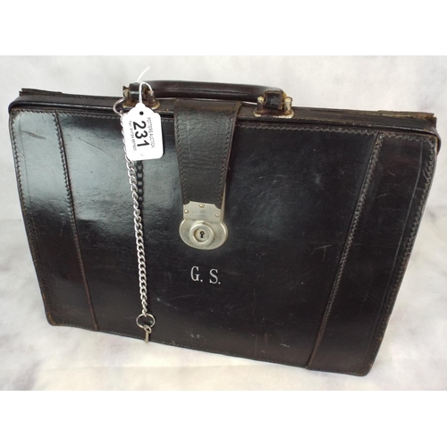 231 - Vintage black leather brief case with key and chain.