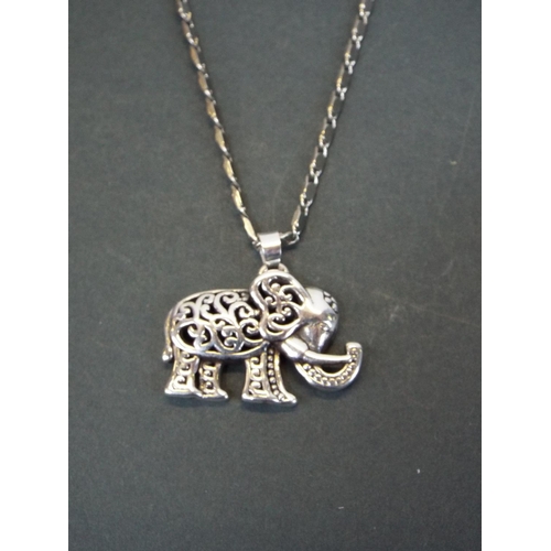 127 - 925 silver elephant pendant on 18ct gold plated chain.