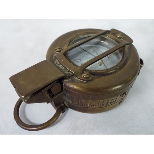 63 - Genuine military issue brass marching compass. Dated 1967