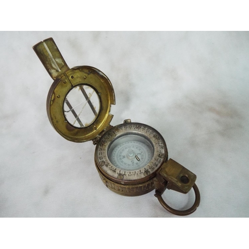 63 - Genuine military issue brass marching compass. Dated 1967