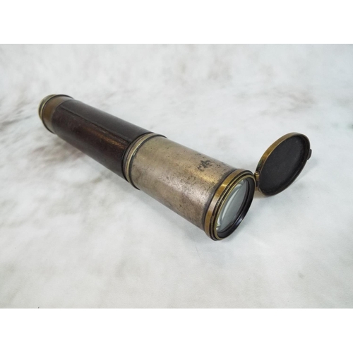 65 - Vintage Brass telescope with hinged lens cover and leather sleeve. Good optics and useable telescope... 