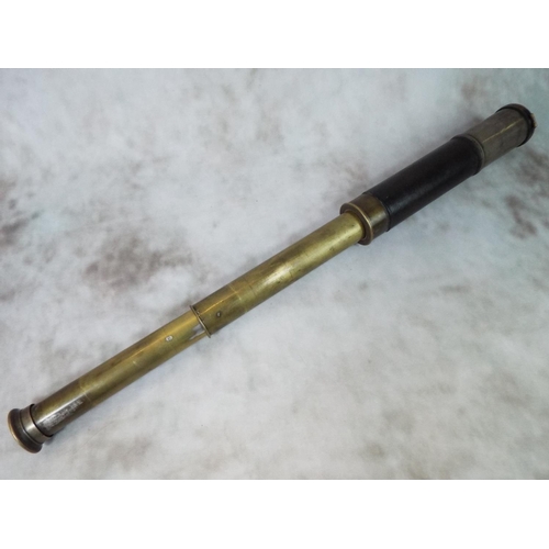 65 - Vintage Brass telescope with hinged lens cover and leather sleeve. Good optics and useable telescope... 