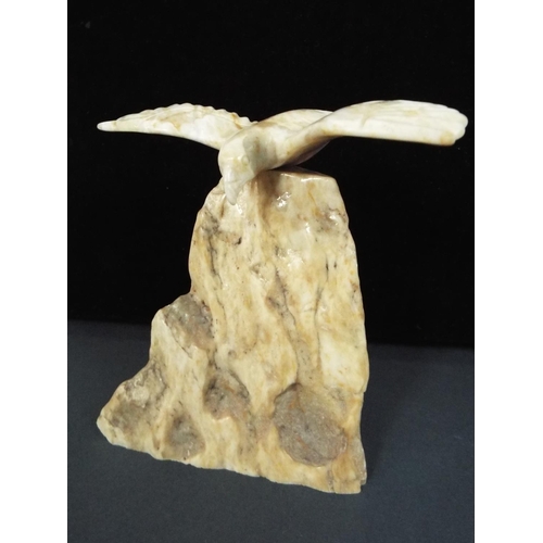 231 - A soaring eagle carved from champagne jade approx 5 inches tall