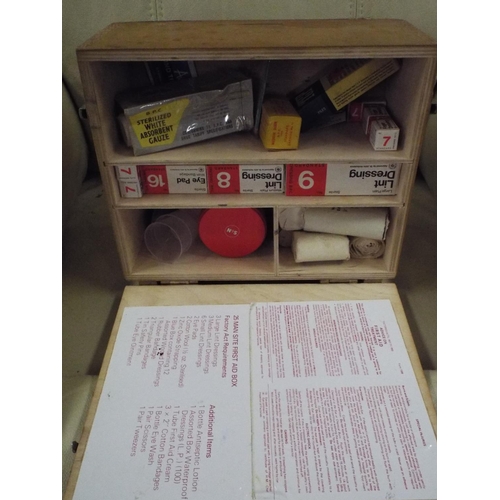 389 - Vintage wooden wall mounted first aid case with contents