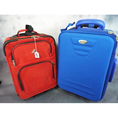 427 - Two airport type wheeled luggage with telescopic handles