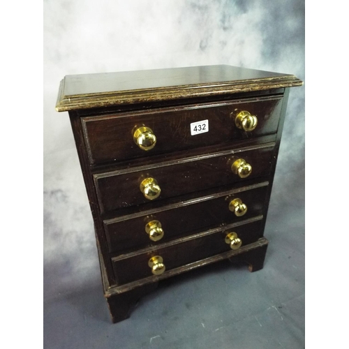 432 - Dark wood  four drawer small cabinet with brass handles