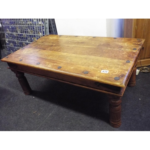 434 - Low oak coffee table with metal studs and turned legs