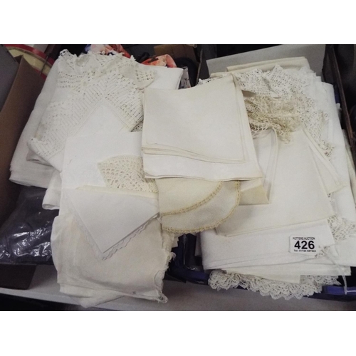 426 - Tray of assorted linen doylies, tablecloths etc