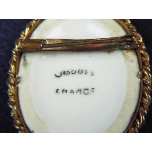 47 - Limoge painted porcelain brooch in gilt metal setting