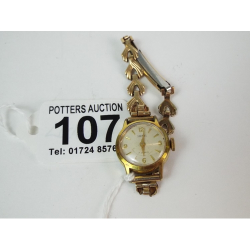 107 - Smith's 17 jewel ladies watch. Yellow metal strap.