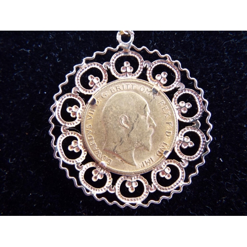 119 - 1910 Half sovereign in a 9ct mount on an 18 inch, 9ct belcher chain.  10.9g total