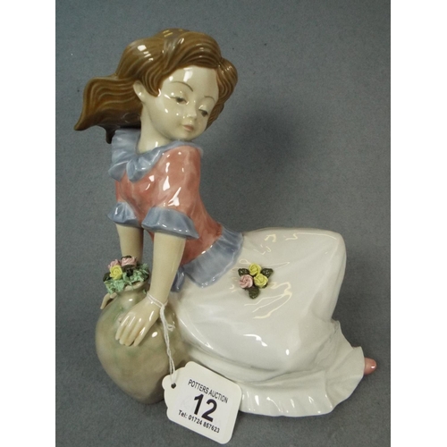 12 - spanish pottery figure of a girl with a flower vase.  10.5 inches tall