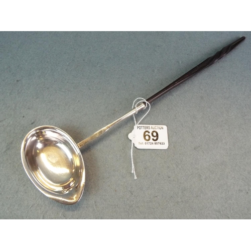 69 - Unmarked ladle (testing as silver) with ebony handle.