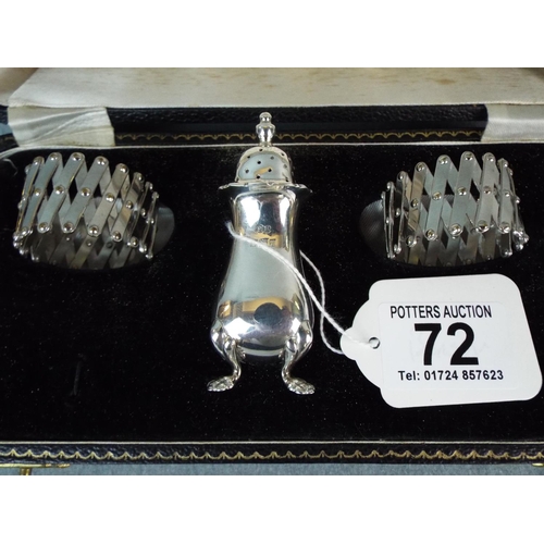 72 - Silver cruet and two expanding serviette rings. Birmingham 1960. Velvet lined presentation box.