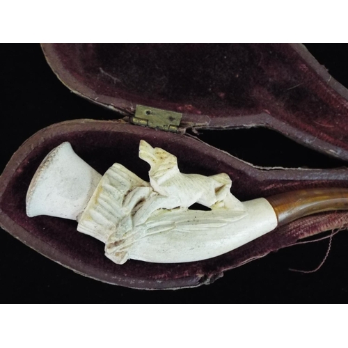 122 - Small Victorian Meerschaum pipe depicting a Gundog, leather case.