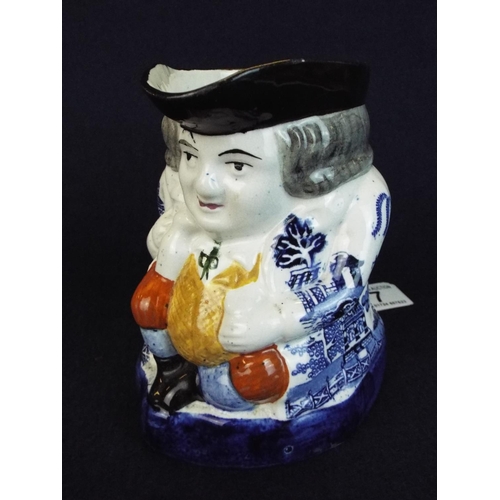 7 - Old Staffordshire toby jug with Blue and white willow pattern coat. C1850's..6 incches tall. Excelle... 