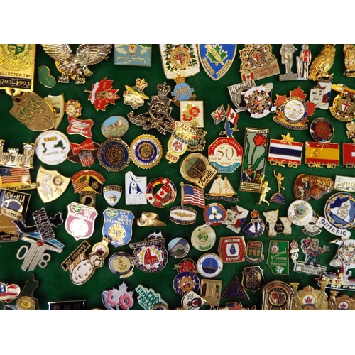 58 - Large Mounted Display of metal and enamel badges