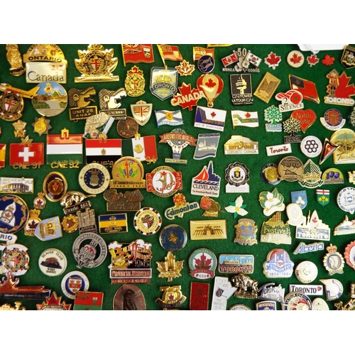 58 - Large Mounted Display of metal and enamel badges