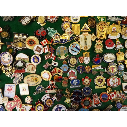 58 - Large Mounted Display of metal and enamel badges