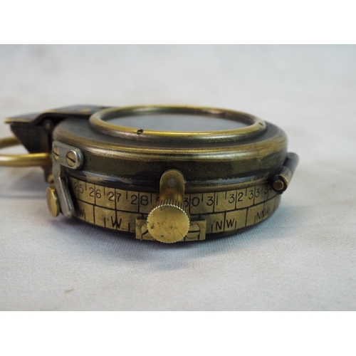 71 - WW1 marching compass with original leather case arrowmarked and dated. Excellent