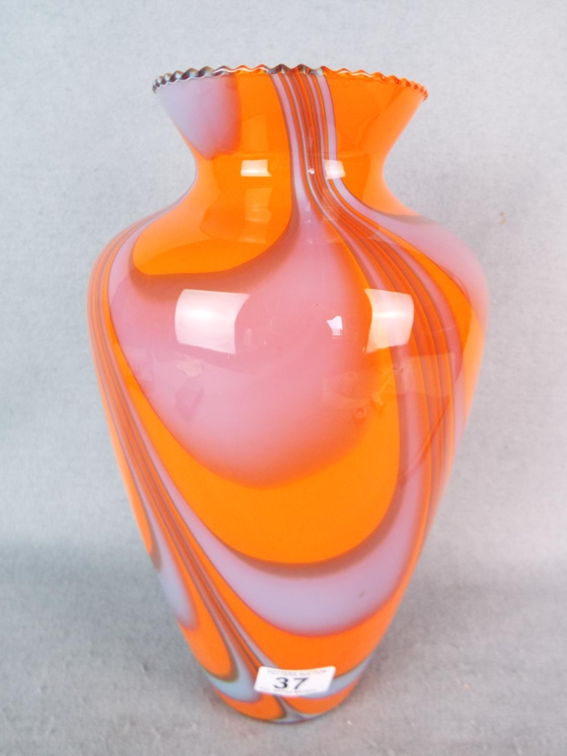 Large art glass vase. Swirl decorated with vivid orange colour