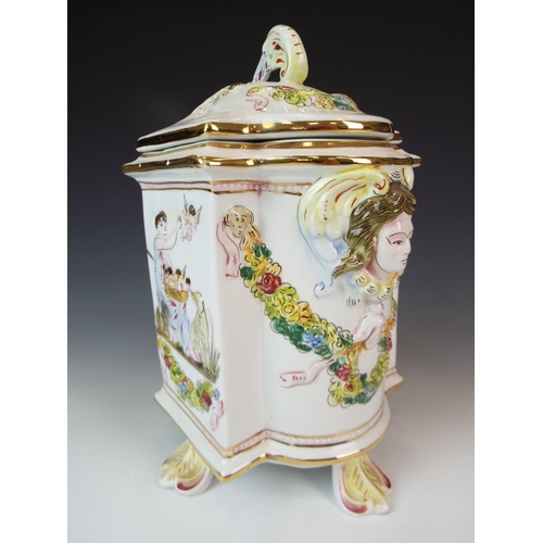 3 - Lovley lidded Capo Di Monte Caddy or Jar. 9.5 Inches tall stands on four leaf feet decoratied with c... 