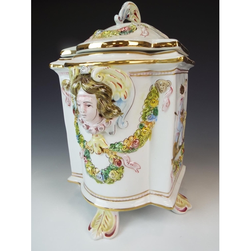 3 - Lovley lidded Capo Di Monte Caddy or Jar. 9.5 Inches tall stands on four leaf feet decoratied with c... 