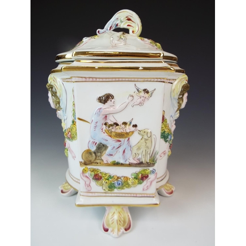 3 - Lovley lidded Capo Di Monte Caddy or Jar. 9.5 Inches tall stands on four leaf feet decoratied with c... 