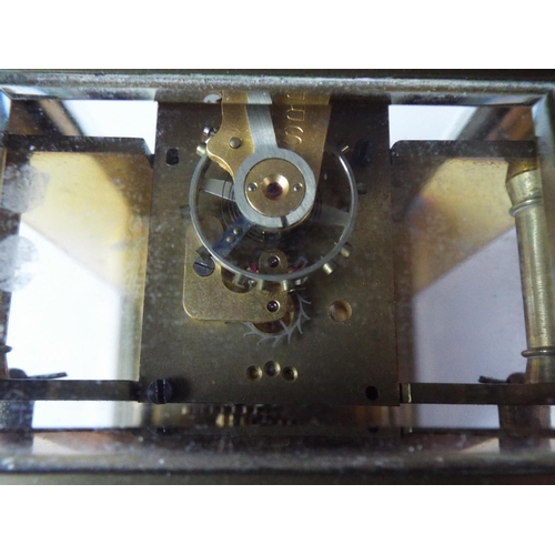 46 - Vintage carriage clock. Possibly French made, Working order with glass sides and top. 6.5 inches tal... 