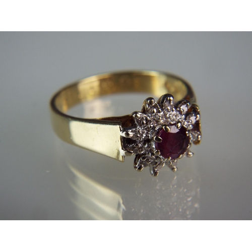 133 - 18ct Ruby and Diamond cluster set ring.  Finger size 'L' 4.4g   Hallmarked for London 1979