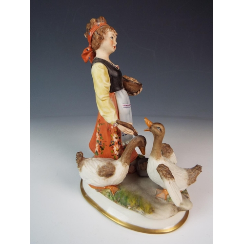 32 - Pretty Capo Di Monte figure of a girl feeding geese.  Excellent detal scultped by Volta.  7 inches t... 