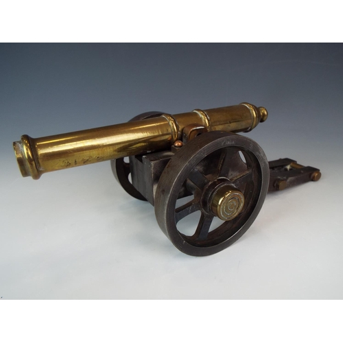 88 - Very heavy Steel and Brass model of a cannon. 9 inches long.