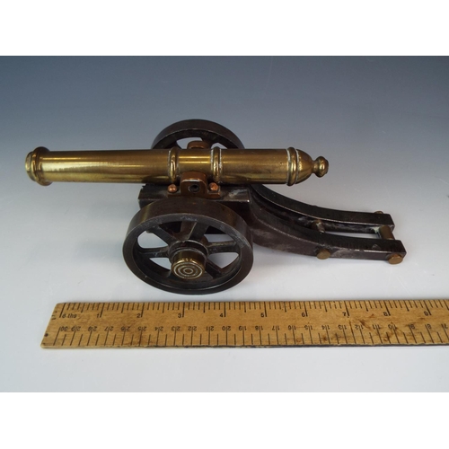 88 - Very heavy Steel and Brass model of a cannon. 9 inches long.