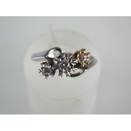 163 - 18ct White Gold ring set with three Diamonds. Centre Diamond 0.10cts with smaller Diamonds of 0.07 c... 