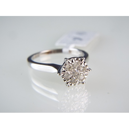 155 - 9ct White gold Diamond cluster ring set in a flower pattern.   0.25 Diamonds   Finger size 'M' 3.1g